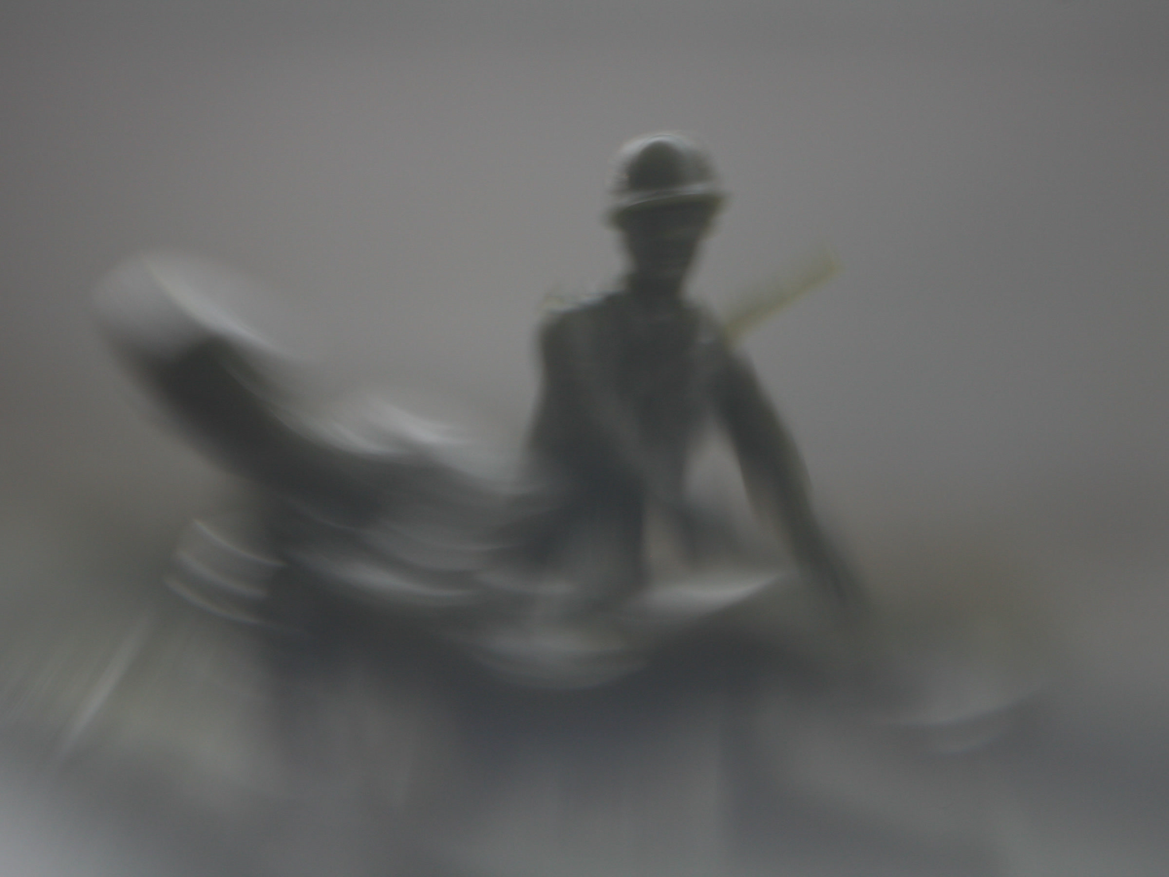 Hazy monochrome figures aboard a raft
